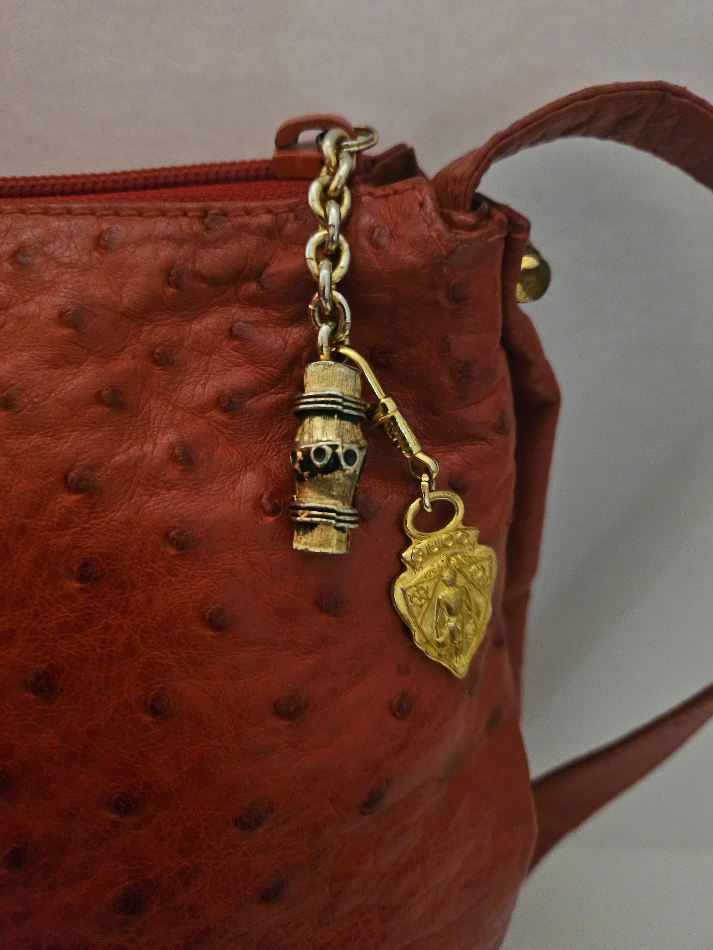 Gucci red ostrich leather cross body bucket bag