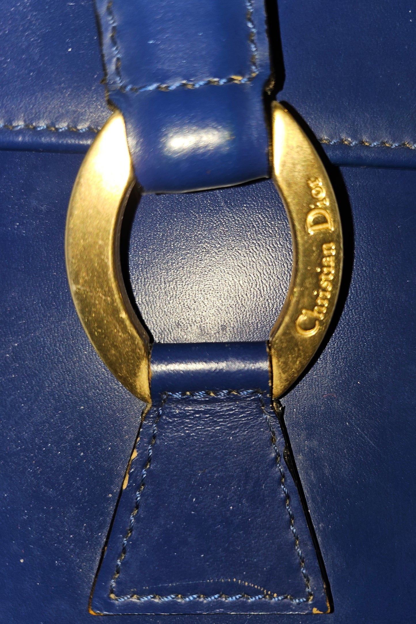 Dior cobalt blue leather satchel with gold engraved hardware.