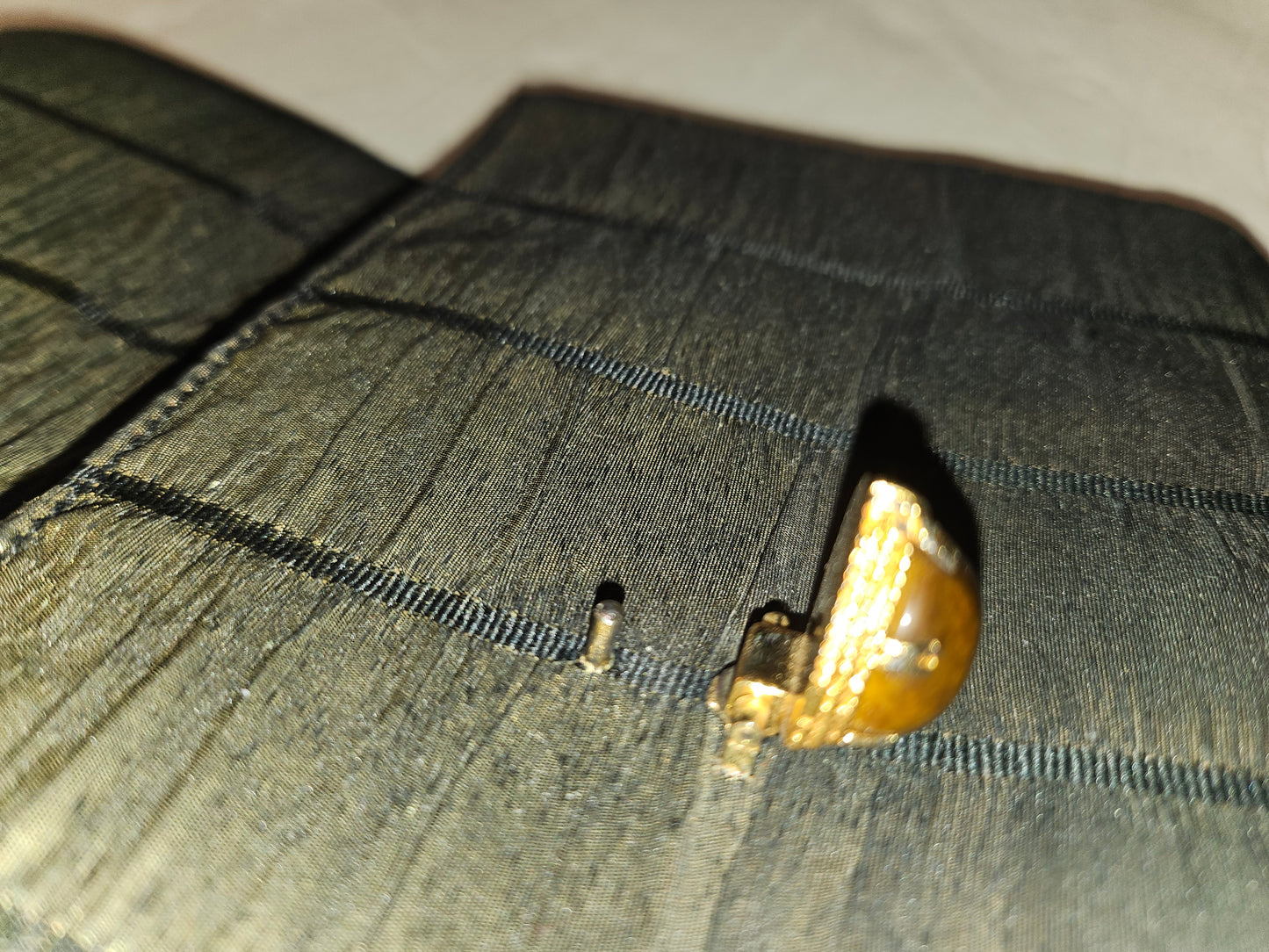 Gucci early black & gold silk taffeta with tiger's eye in 14K clasp