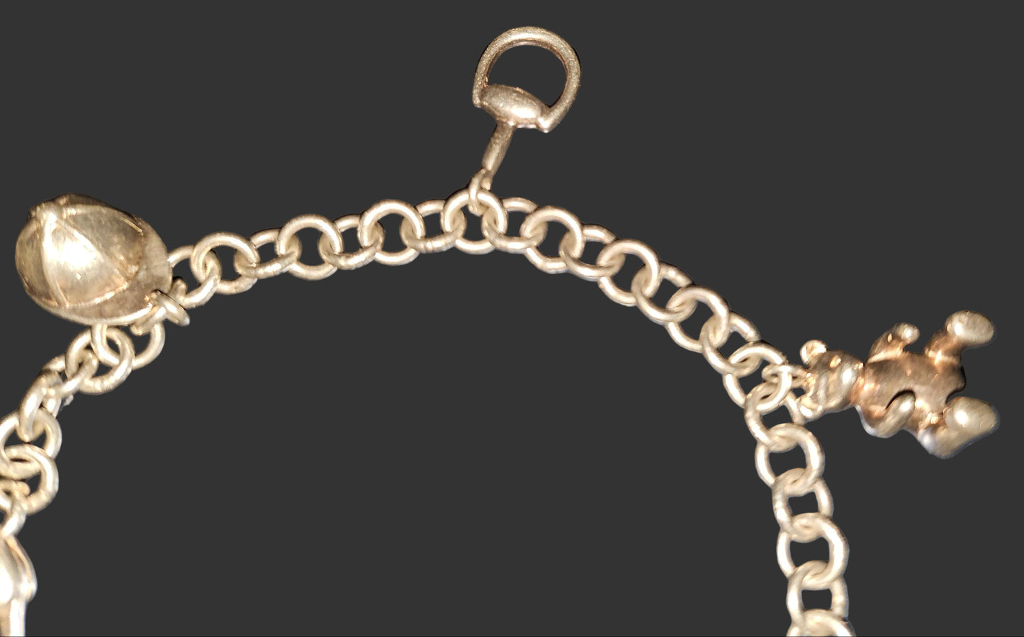 Gucci sterling charm bracelet with round links & six iconic charms 400/500