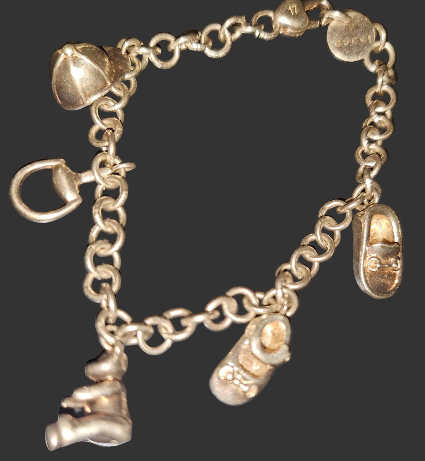 Gucci sterling charm bracelet with round links & six iconic charms 400/500