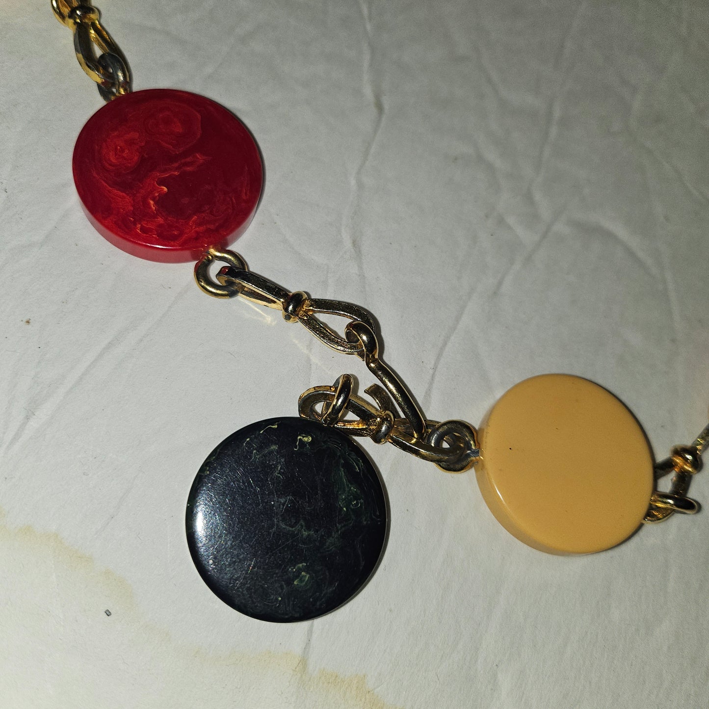 Dior early Bakelite disc chain belt in red, ivory, & blue