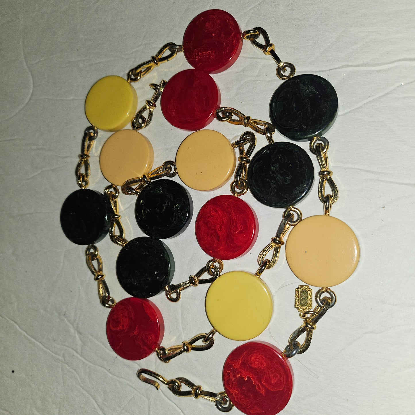 Dior early Bakelite disc chain belt in red, ivory, & blue