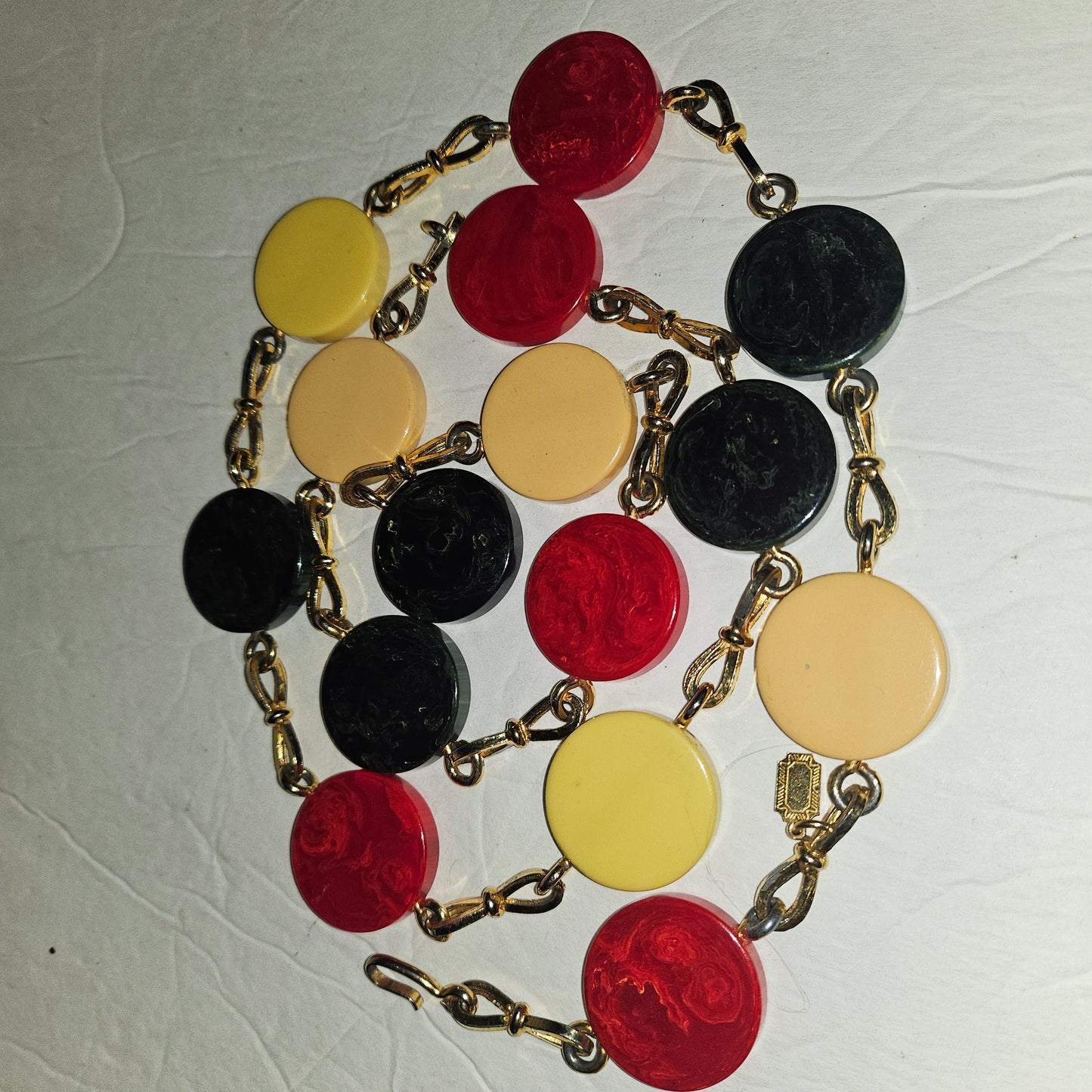 Dior early Bakelite disc chain belt in red, ivory, & blue