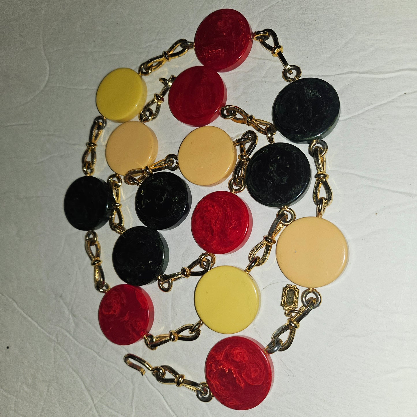Dior early Bakelite disc chain belt in red, ivory, & blue