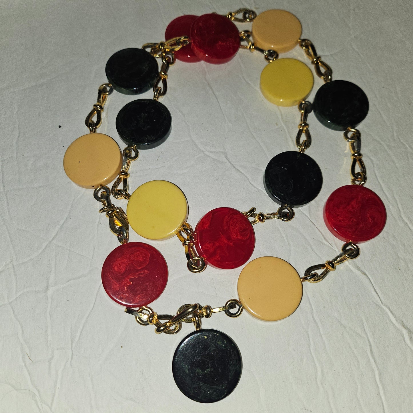 Dior early Bakelite disc chain belt in red, ivory, & blue