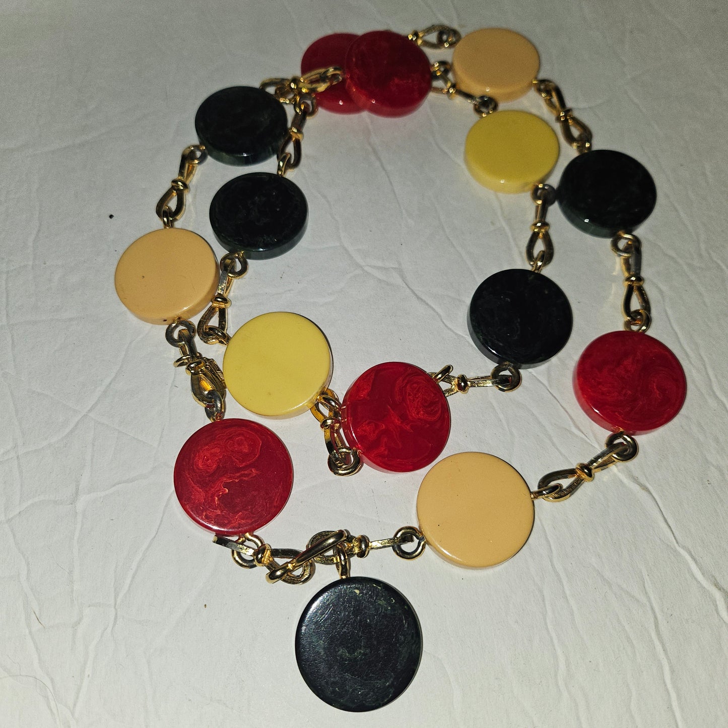 Dior early Bakelite disc chain belt in red, ivory, & blue