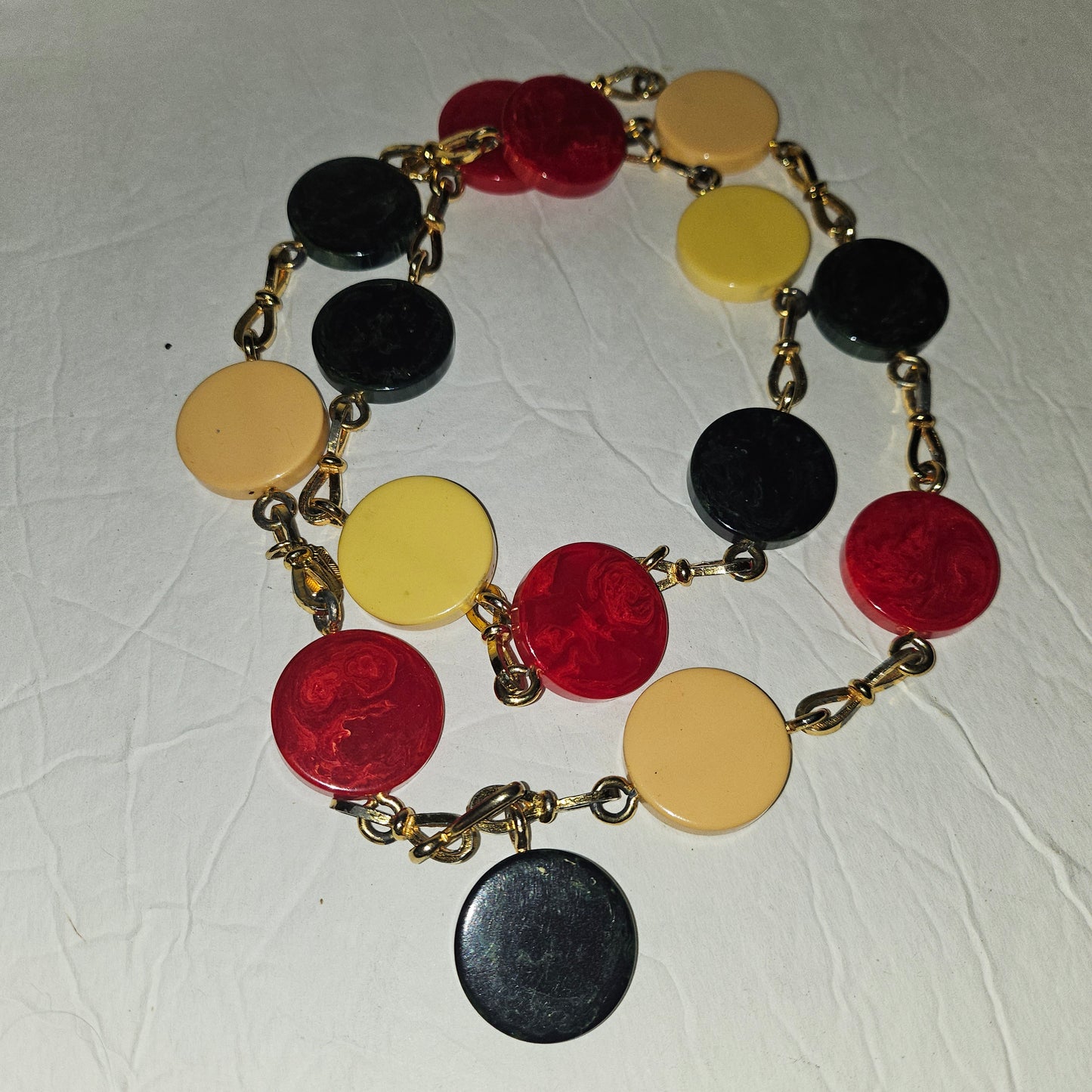 Dior early Bakelite disc chain belt in red, ivory, & blue