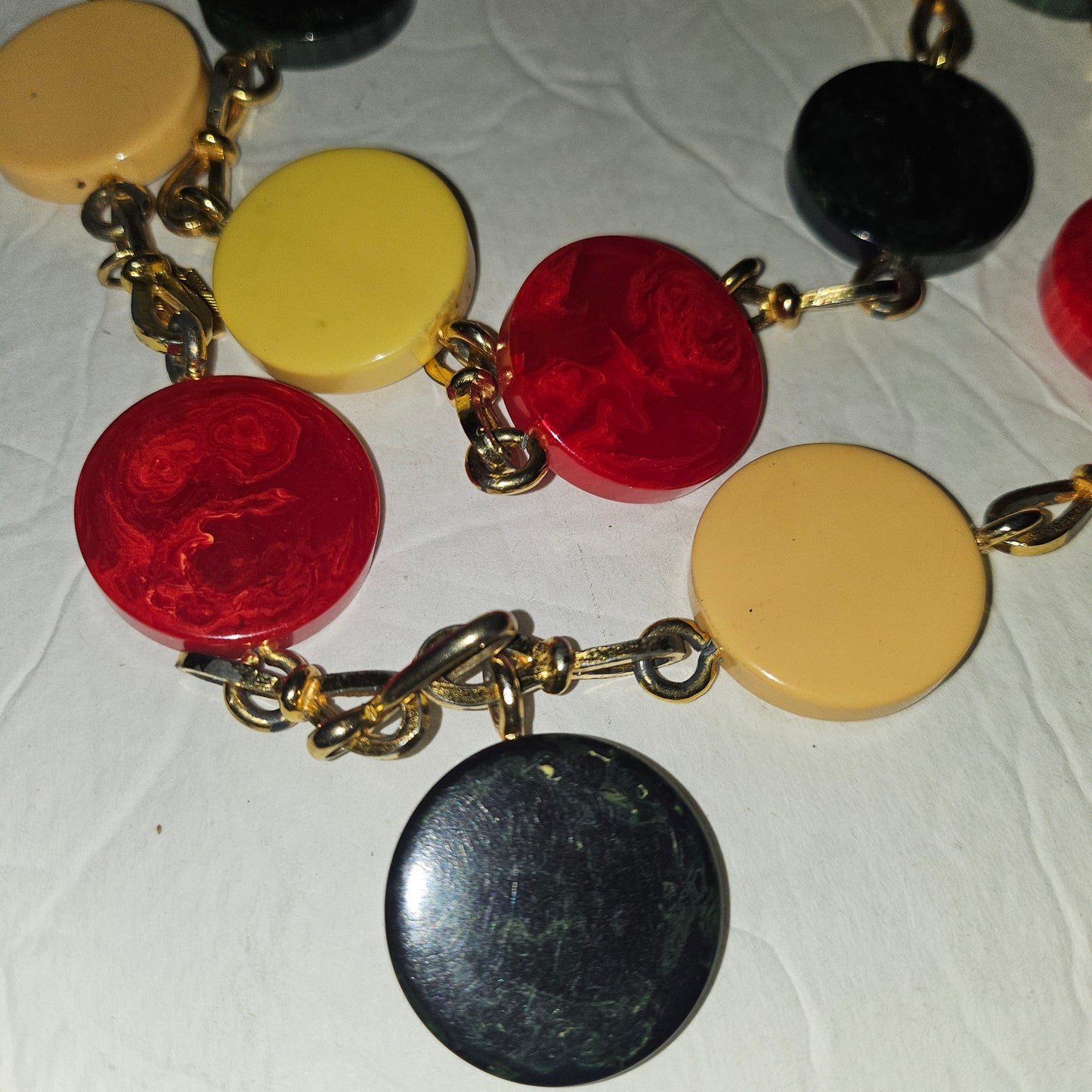 Dior early Bakelite disc chain belt in red, ivory, & blue