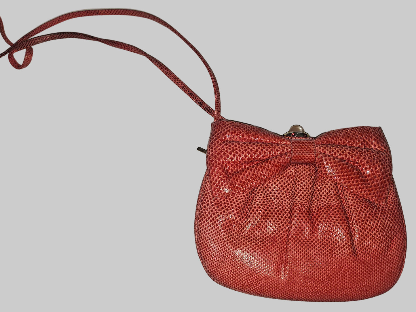 Judith Lieber unique red reptile skin leather two-way bag with a bow accent & rose quartz & ruby cabochon clasp