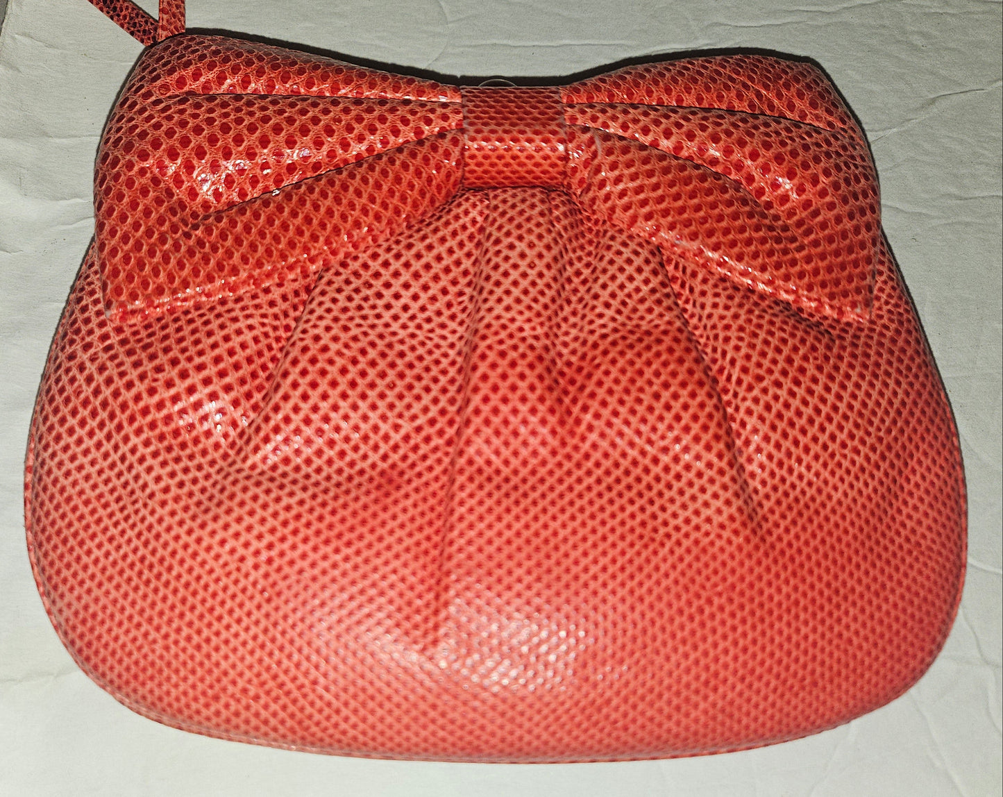 Judith Lieber unique red reptile skin leather two-way bag with a bow accent & rose quartz & ruby cabochon clasp