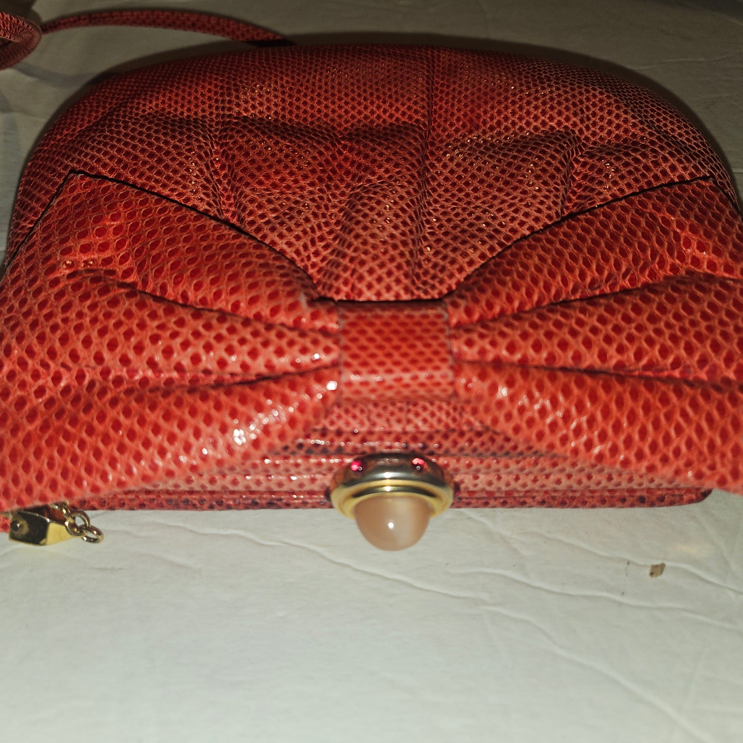 Judith Lieber unique red reptile skin leather two-way bag with a bow accent & rose quartz & ruby cabochon clasp