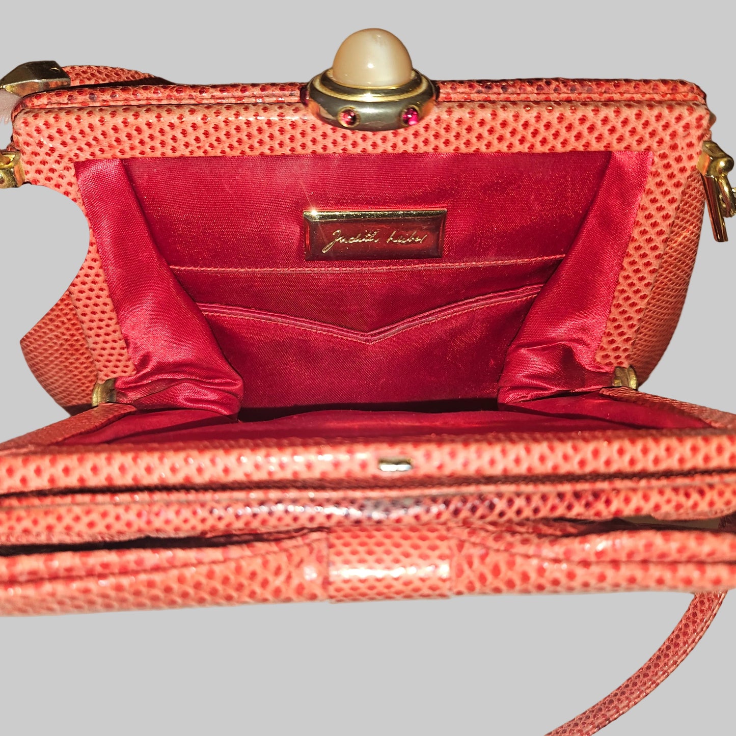 Judith Lieber unique red reptile skin leather two-way bag with a bow accent & rose quartz & ruby cabochon clasp
