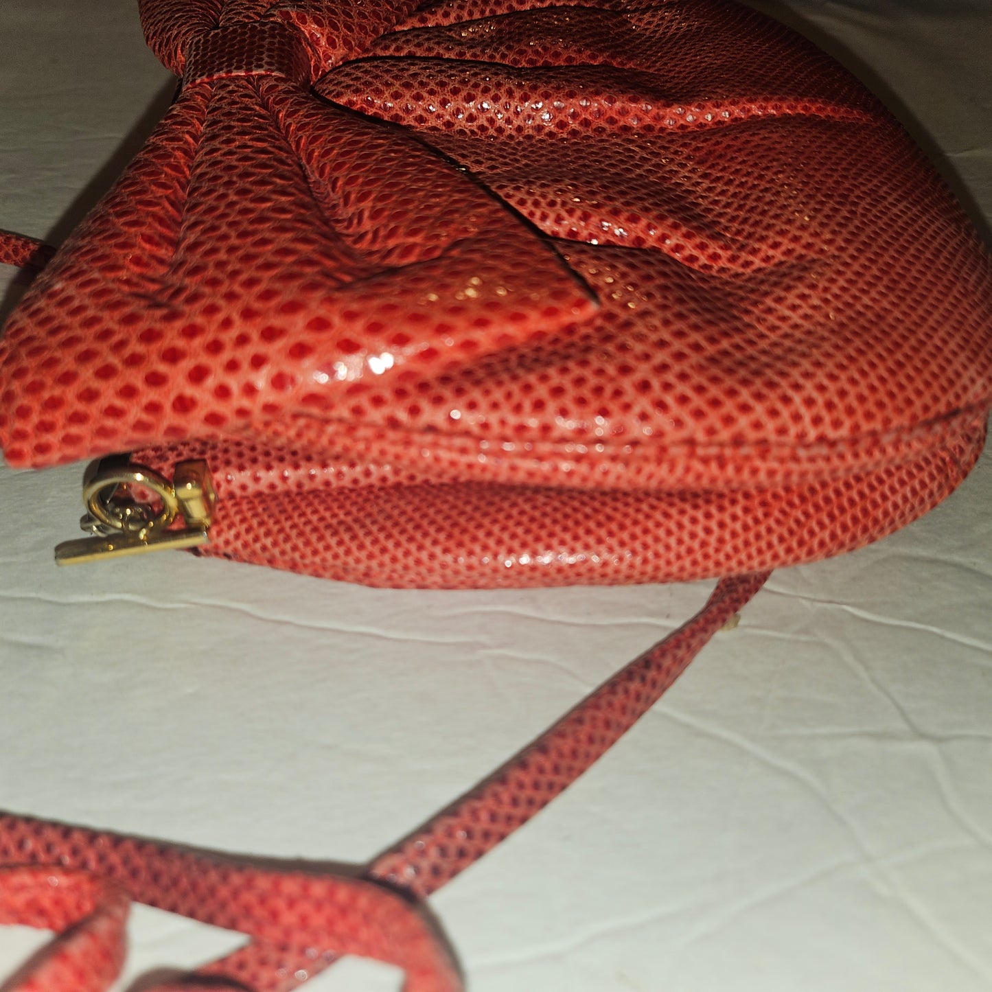 Judith Lieber unique red reptile skin leather two-way bag with a bow accent & rose quartz & ruby cabochon clasp