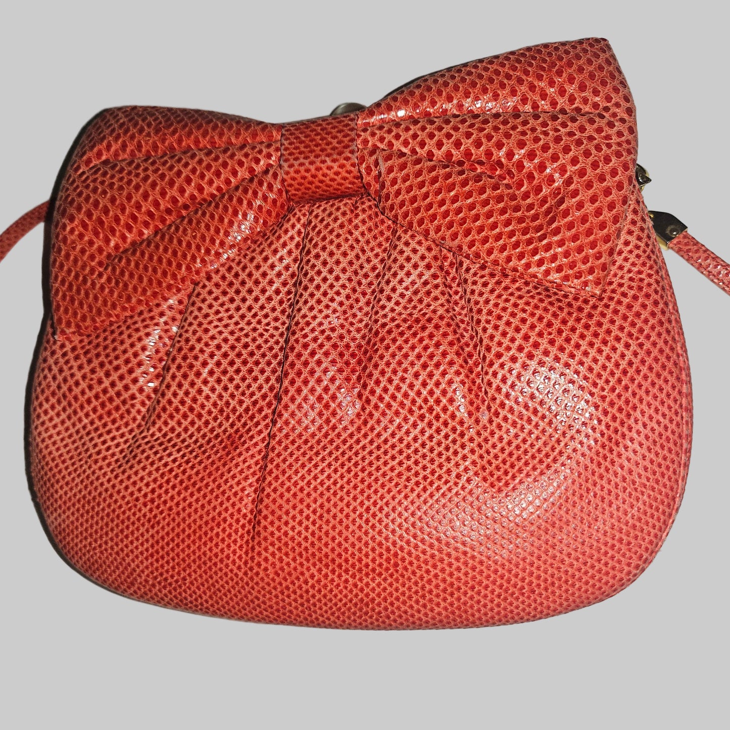 Judith Lieber unique red reptile skin leather two-way bag with a bow accent & rose quartz & ruby cabochon clasp