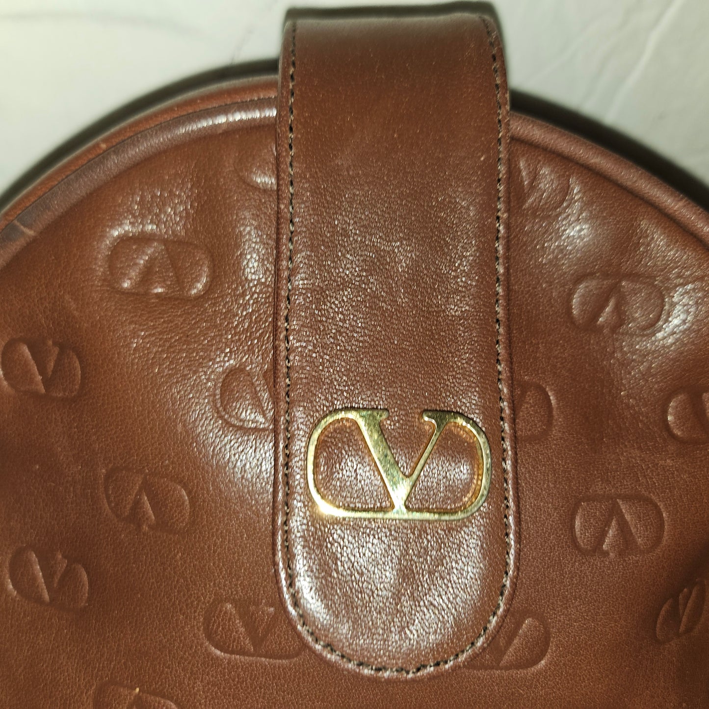 Valentino brown leather round canteen style bag w logo embossed