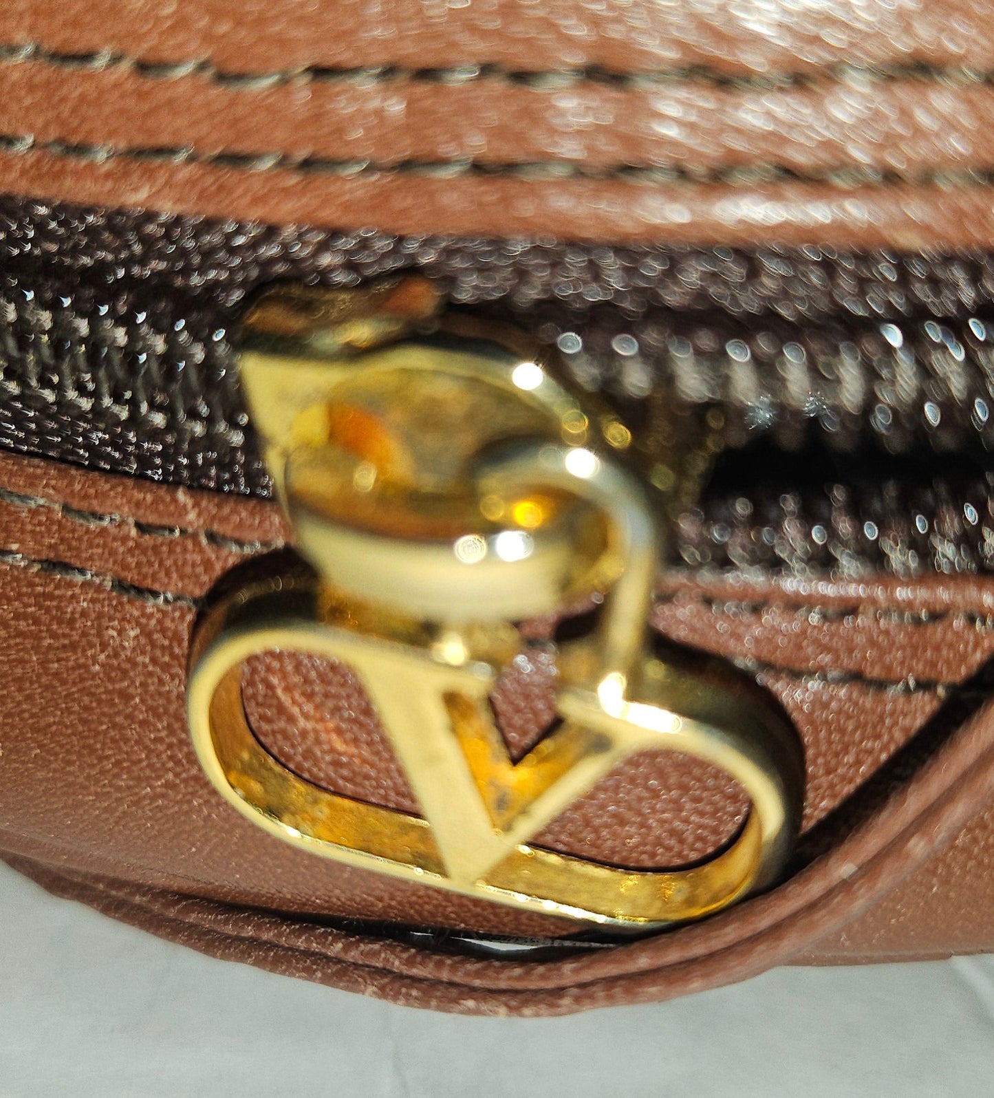 Valentino brown leather round canteen style bag w logo embossed