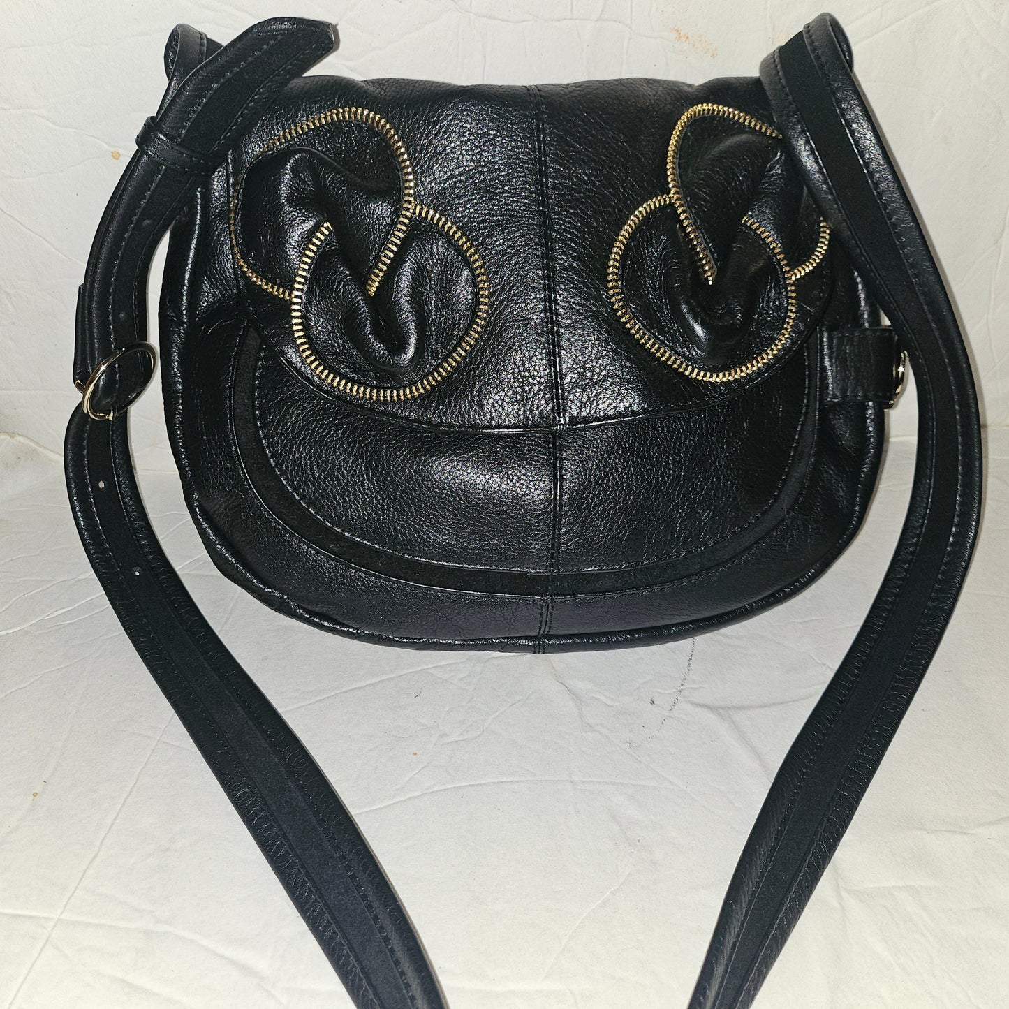 See By Chloe black pebbled leather saddle bag with two leather flowers