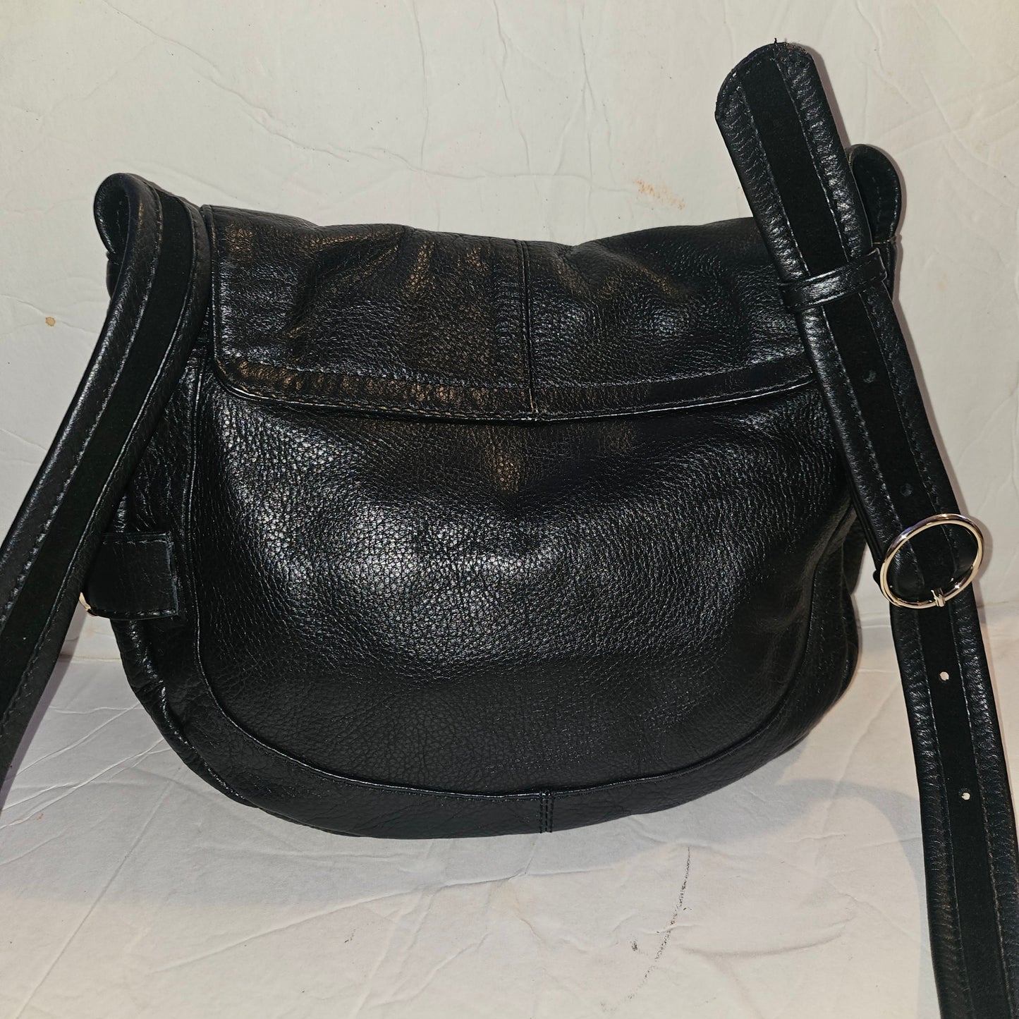 See By Chloe black pebbled leather saddle bag with two leather flowers