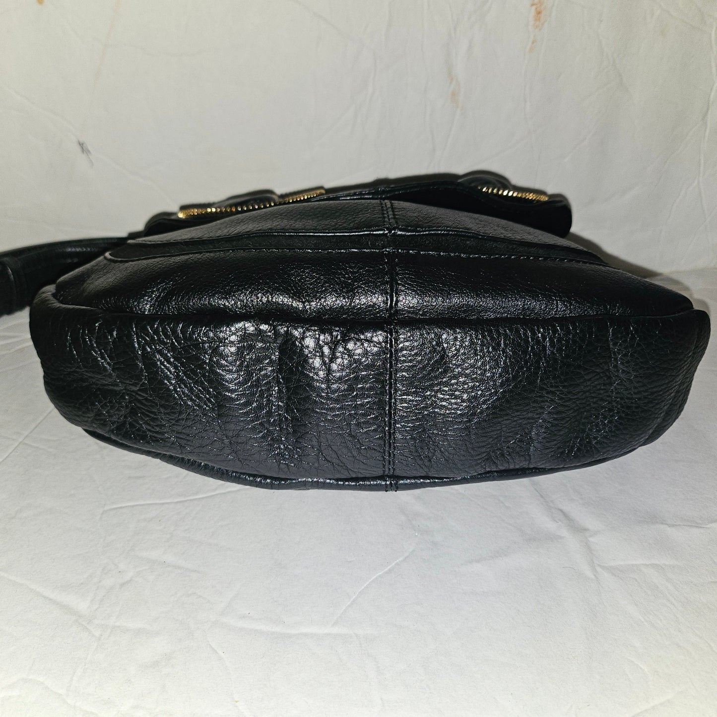 See By Chloe black pebbled leather saddle bag with two leather flowers