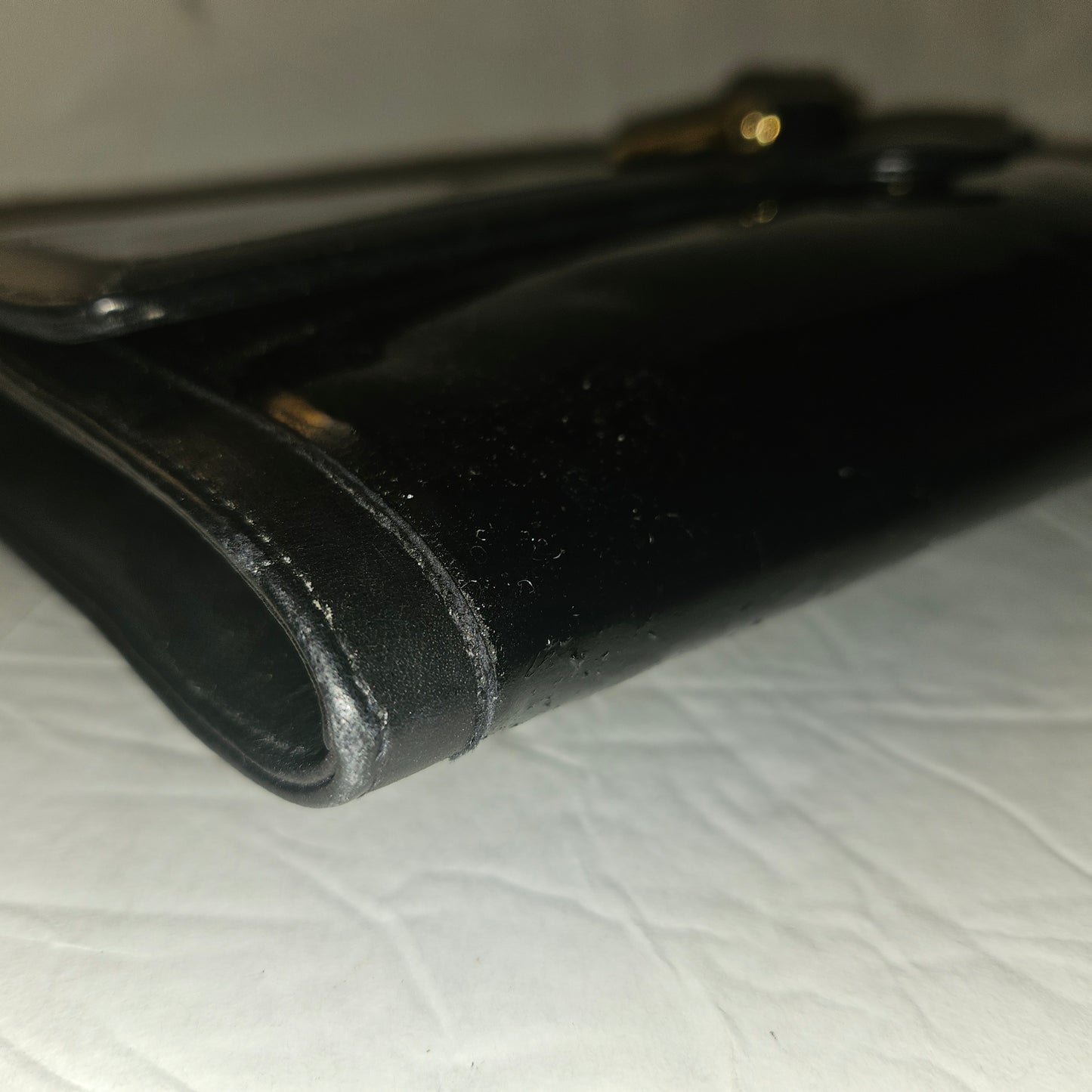 Gucci black patent leather XL asymmetrical envelope top clutch with a gold equestrian accent
