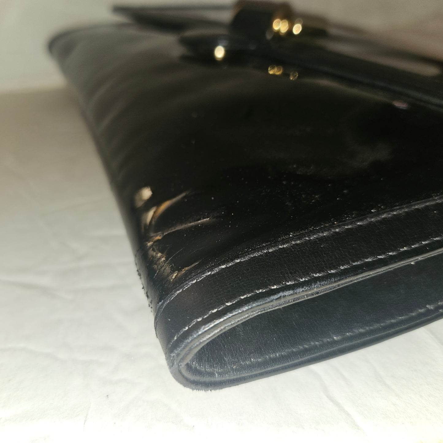 Gucci black patent leather XL asymmetrical envelope top clutch with a gold equestrian accent