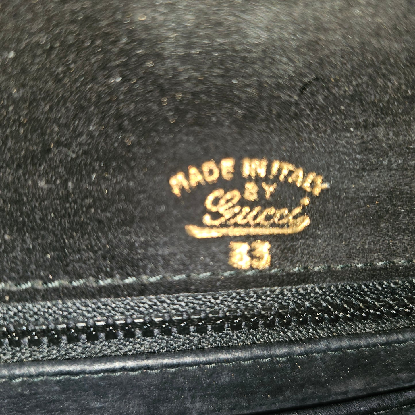 Gucci black patent leather XL asymmetrical envelope top clutch with a gold equestrian accent