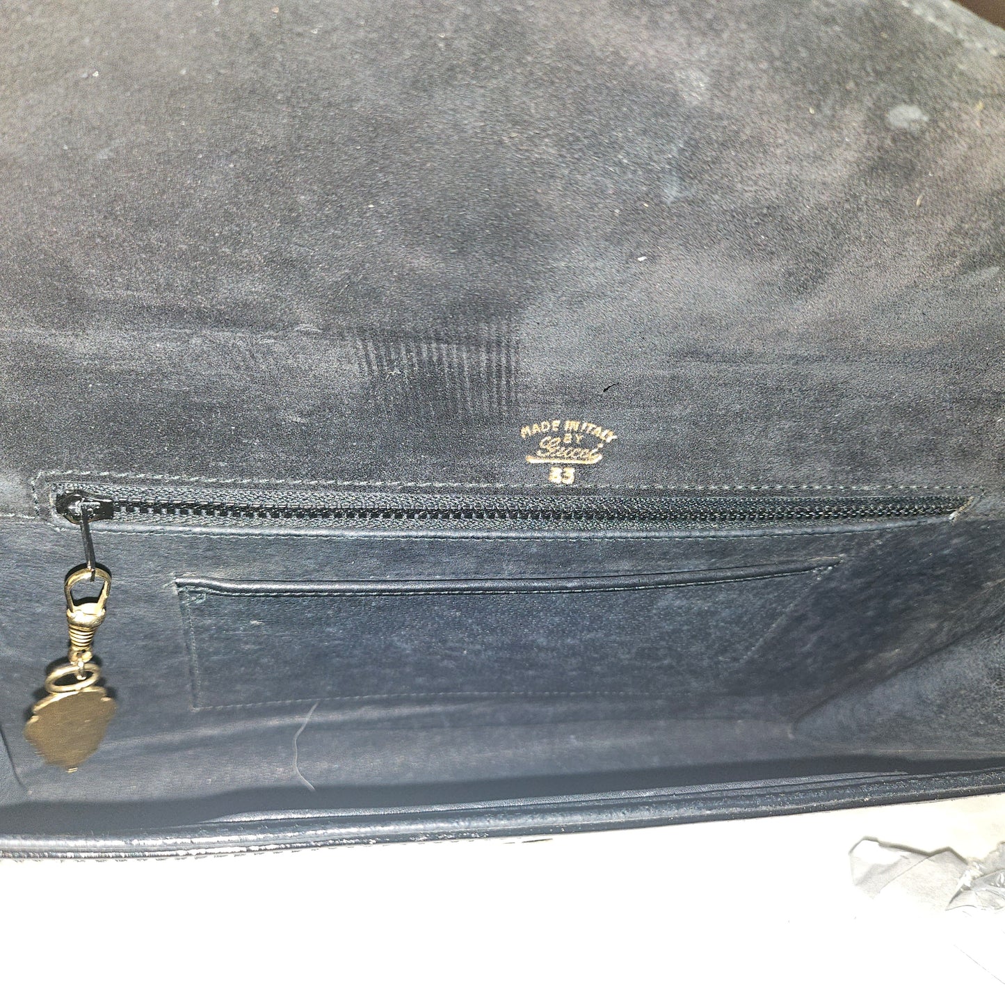 Gucci black patent leather XL asymmetrical envelope top clutch with a gold equestrian accent