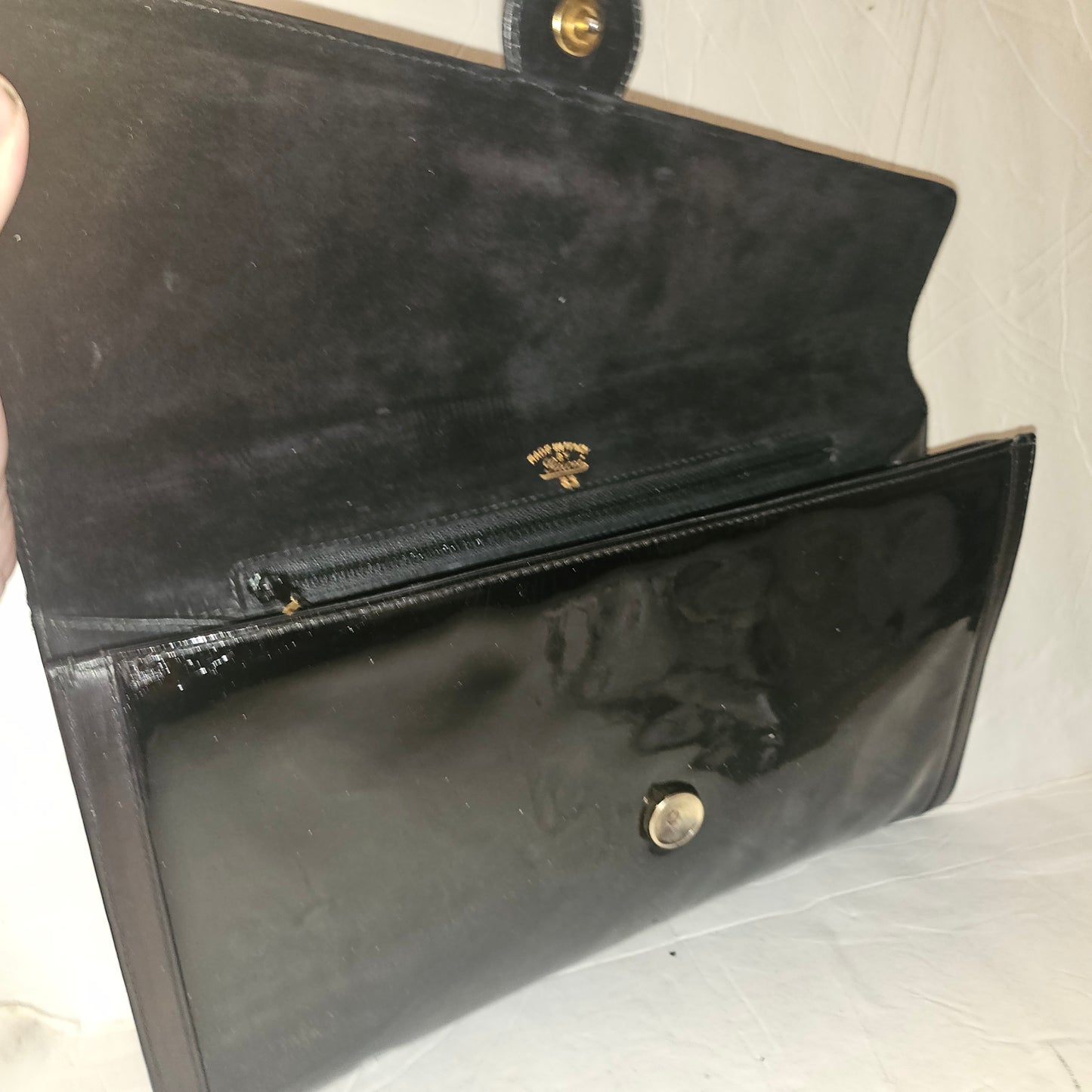 Gucci black patent leather XL asymmetrical envelope top clutch with a gold equestrian accent