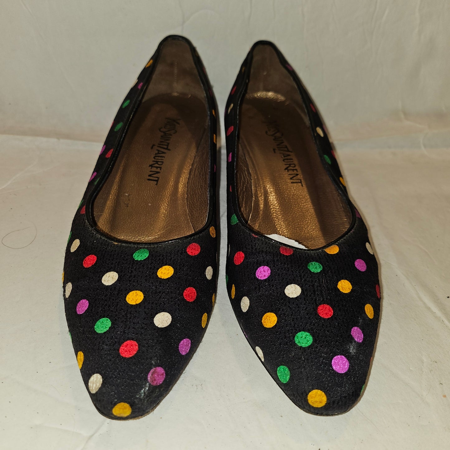 Yves Saint Laurent navy flats with multicolored polka dots