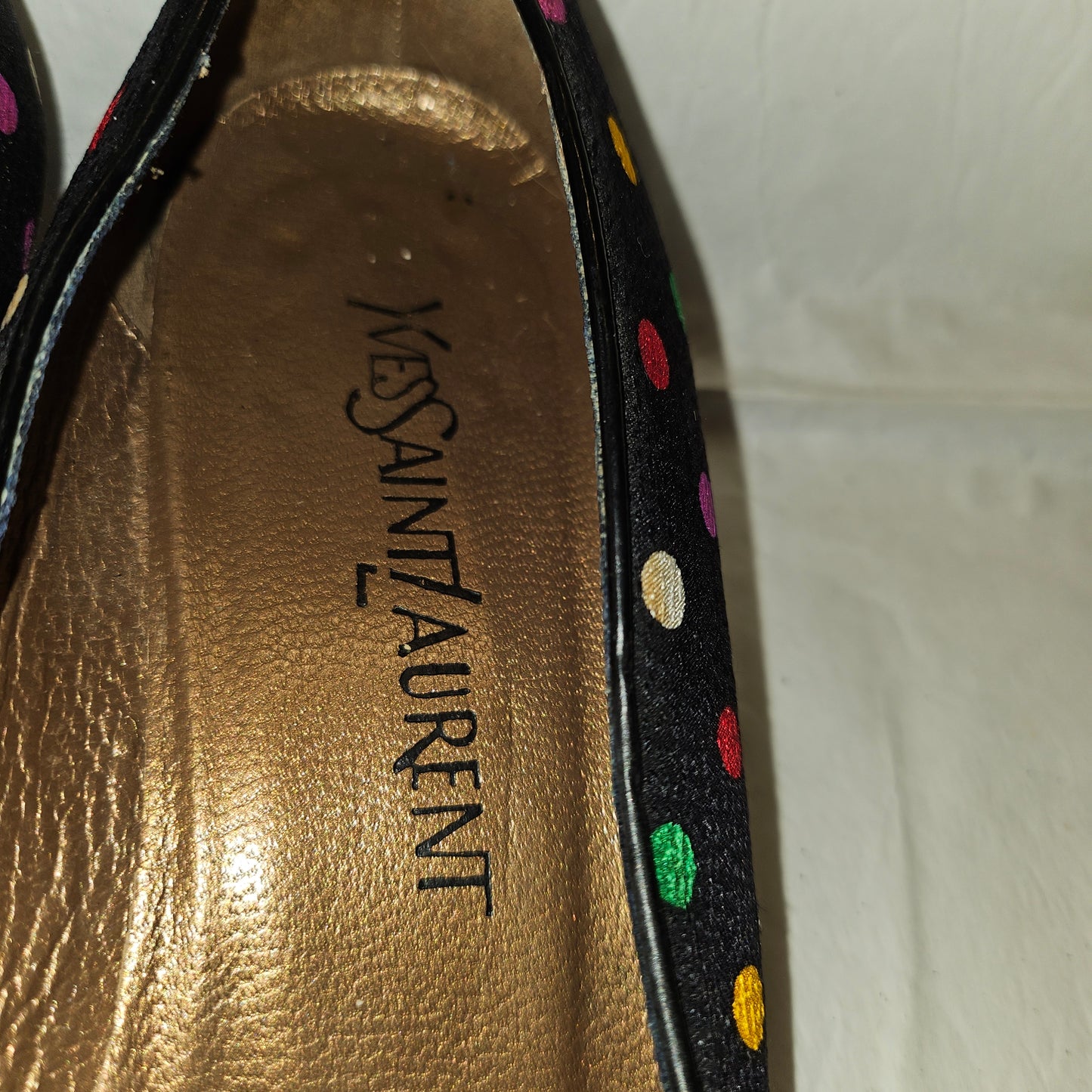 Yves Saint Laurent navy flats with multicolored polka dots