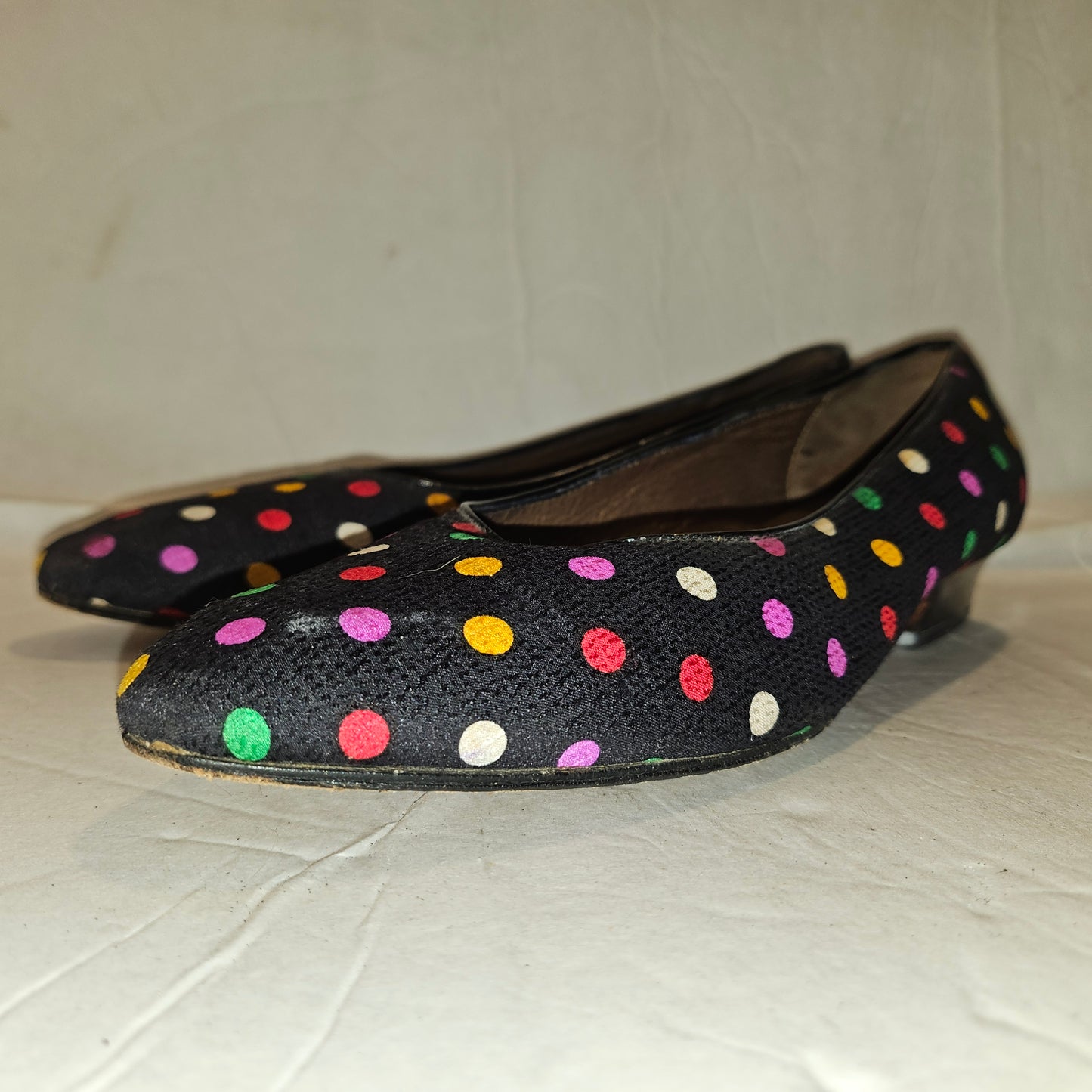 Yves Saint Laurent navy flats with multicolored polka dots