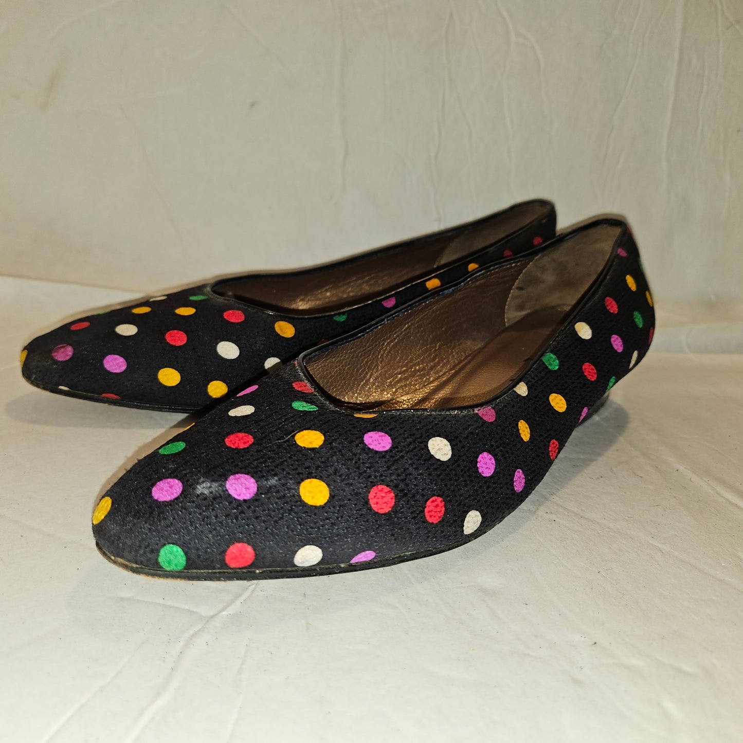 Yves Saint Laurent navy flats with multicolored polka dots