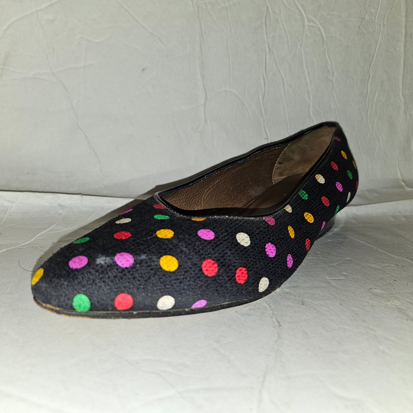 Yves Saint Laurent navy flats with multicolored polka dots