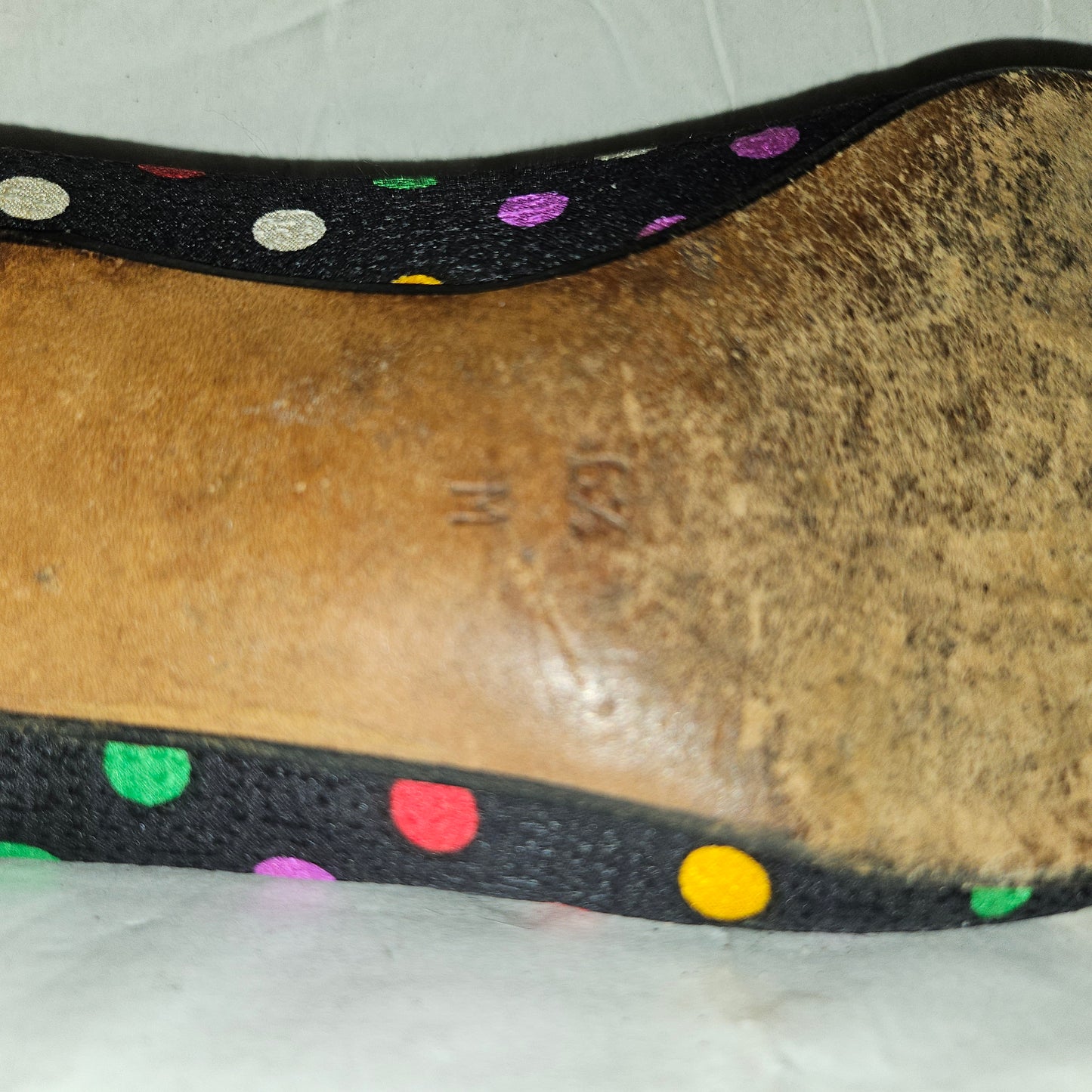 Yves Saint Laurent navy flats with multicolored polka dots