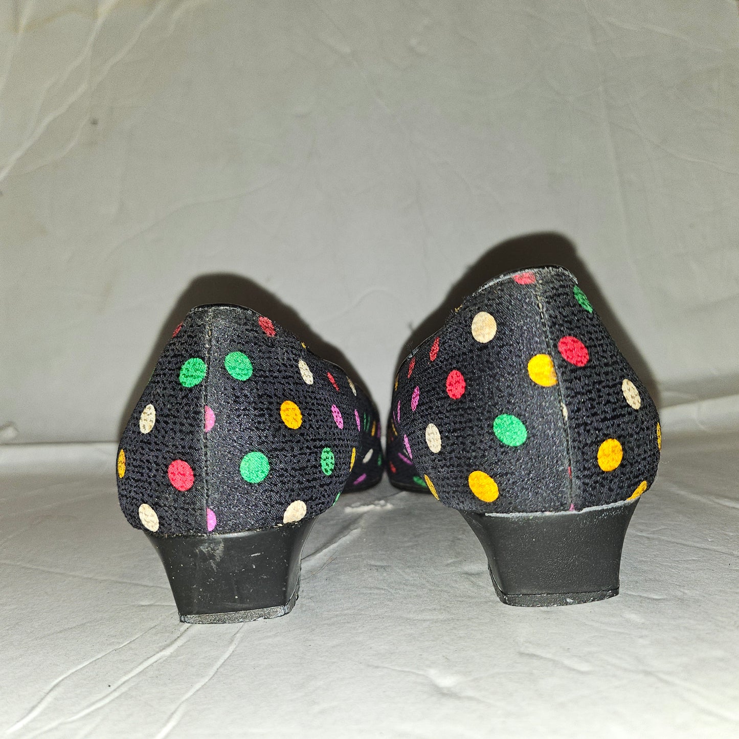 Yves Saint Laurent navy flats with multicolored polka dots