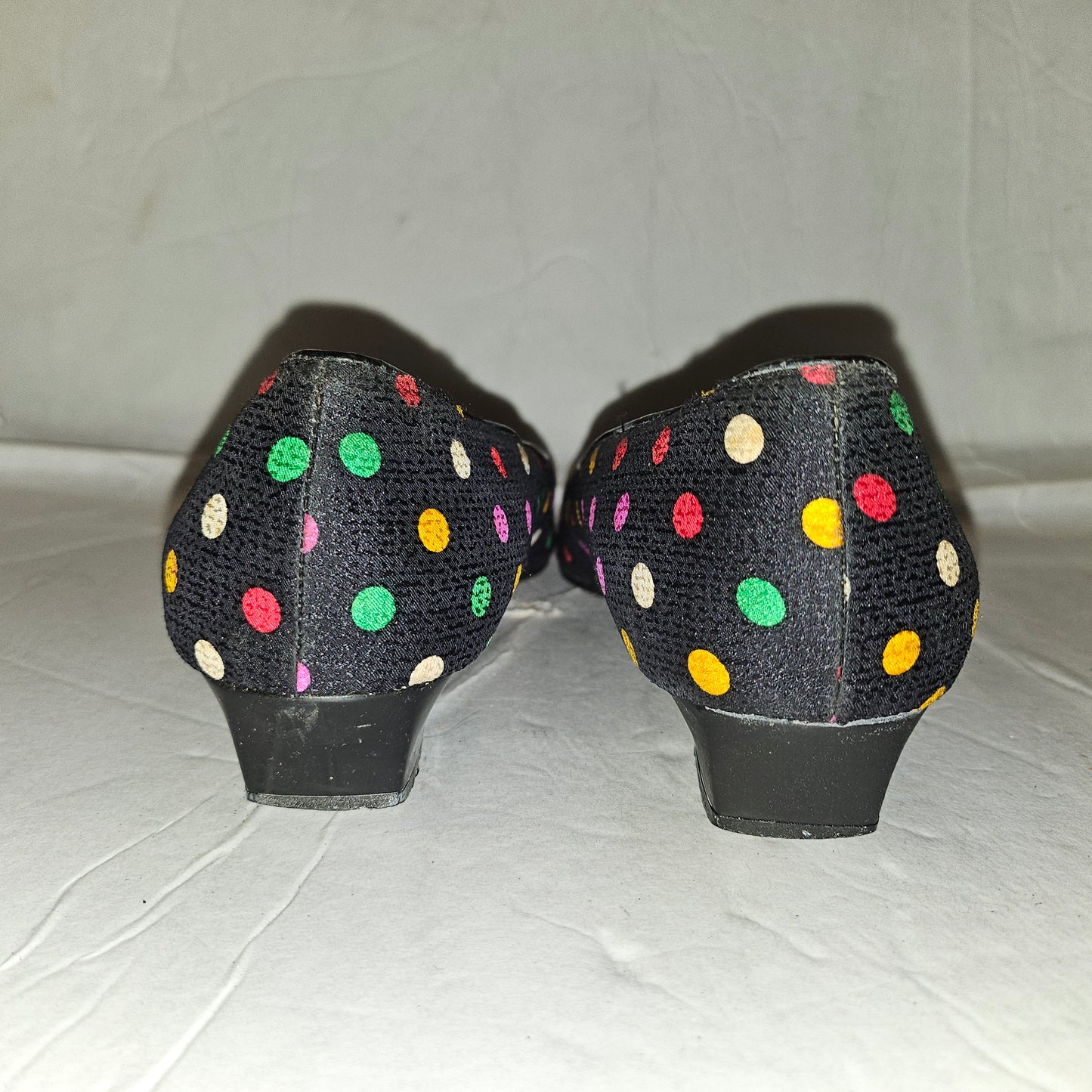 Yves Saint Laurent navy flats with multicolored polka dots