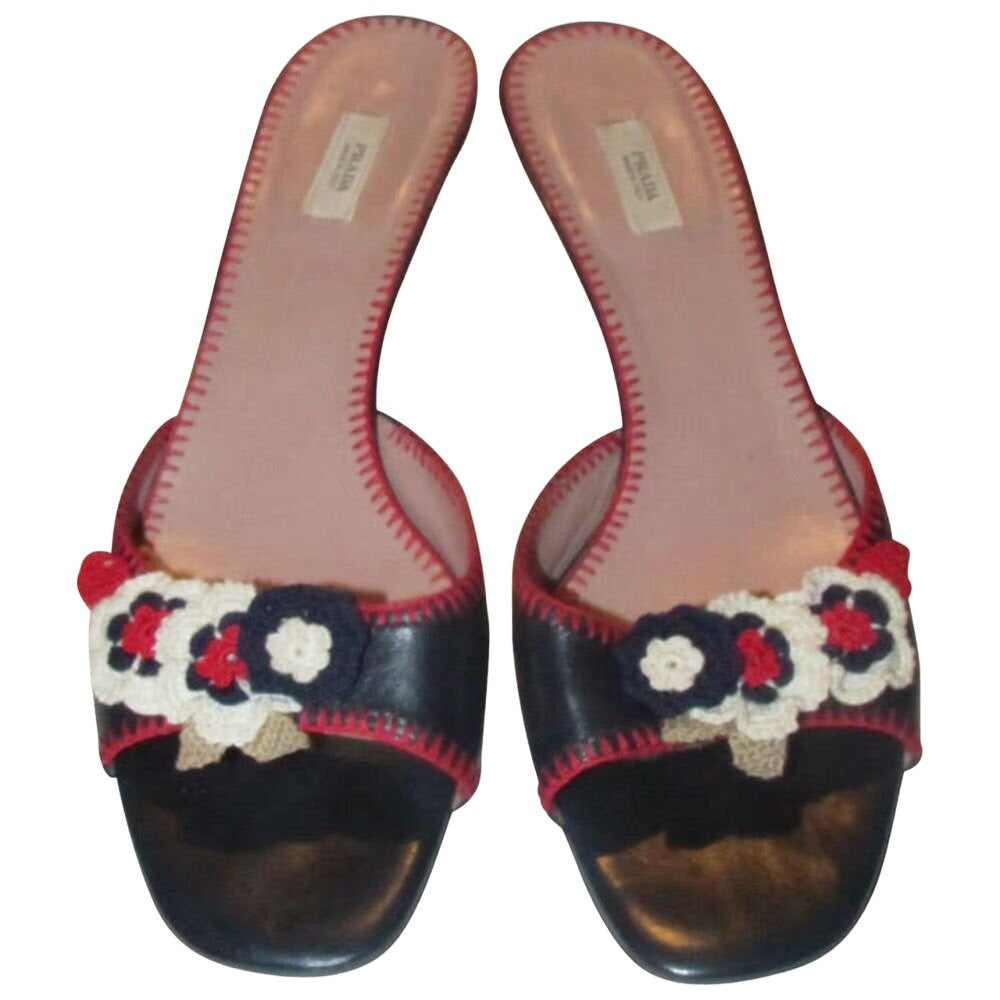 Prada navy & red leather kitten heels w crochet floral accents