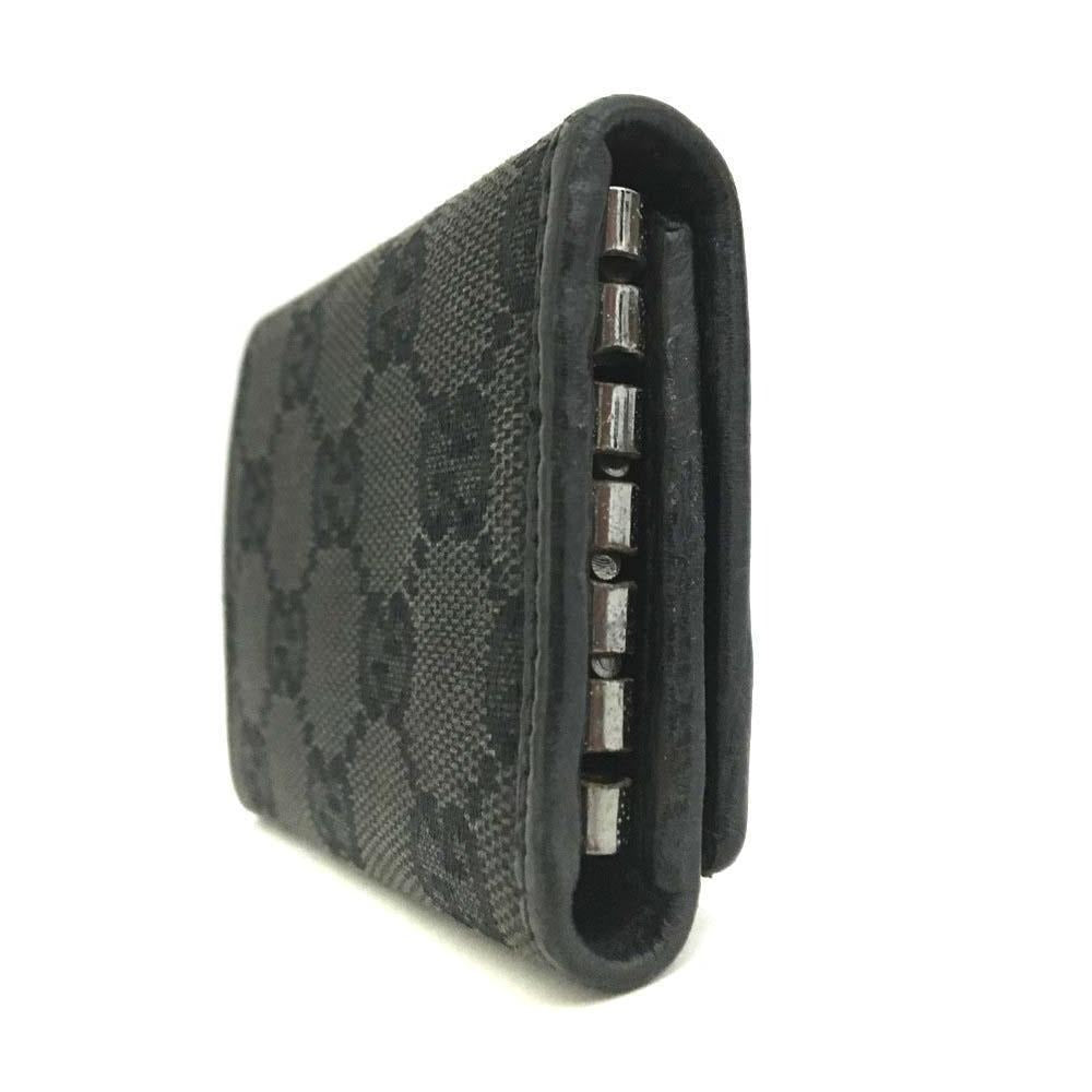 Gucci, black Guccissima print/leather, tri-fold, key holder/card holder, mini- wallet w bamboo accent & slots for your cards