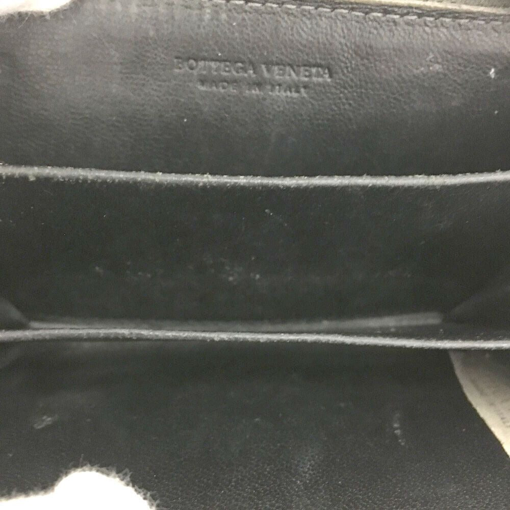Bottega Veneta, grey intrecciato leather wallet with three compartments and a zip around style!
