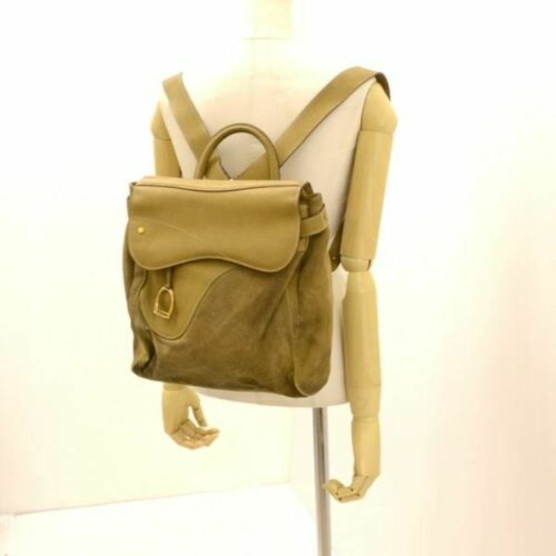 RARE, Gucci, Stirrup style camel suede and leather saddle bag top backpack or messenger bag with a gold stirrup accent