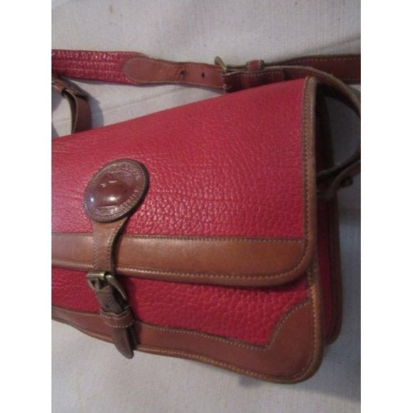 Vintage, Dooney and Bourke AWL, textured red leather and smooth camel leather, envelope top, cross body or shoulder bag with a removable adjustable strap, exterior pockets, brass accents