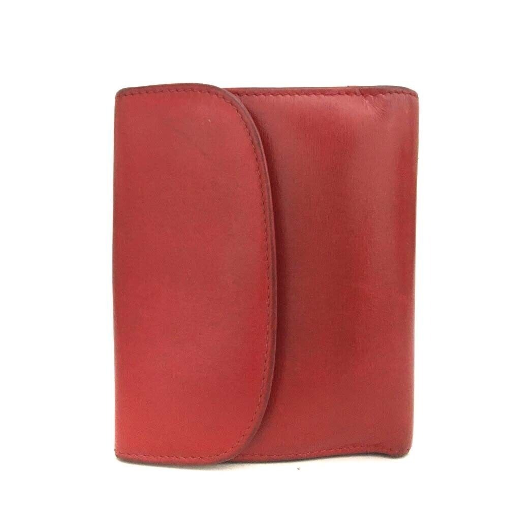 Gucci, red leather, bi-fold style, wallet with multiple pockets, tons of card slots, & a gold, engraved 'GUCCI' horseshoe accent