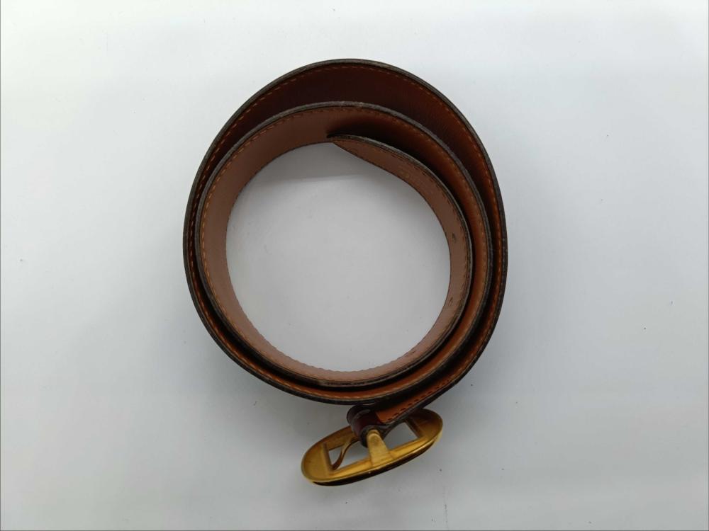 Hermes burgundy leather bet with gold engraved buckle