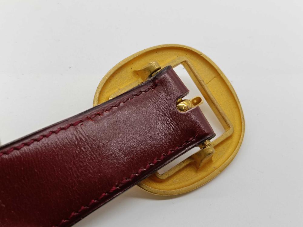 Hermes burgundy leather bet with gold engraved buckle