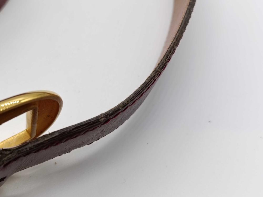 Hermes burgundy leather bet with gold engraved buckle