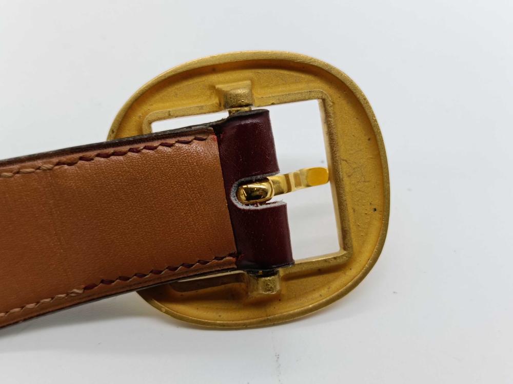Hermes burgundy leather bet with gold engraved buckle