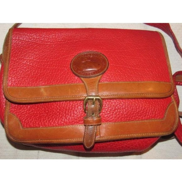 Vintage, Dooney and Bourke AWL, textured red leather and smooth camel leather, envelope top, cross body or shoulder bag with a removable adjustable strap, exterior pockets, brass accents