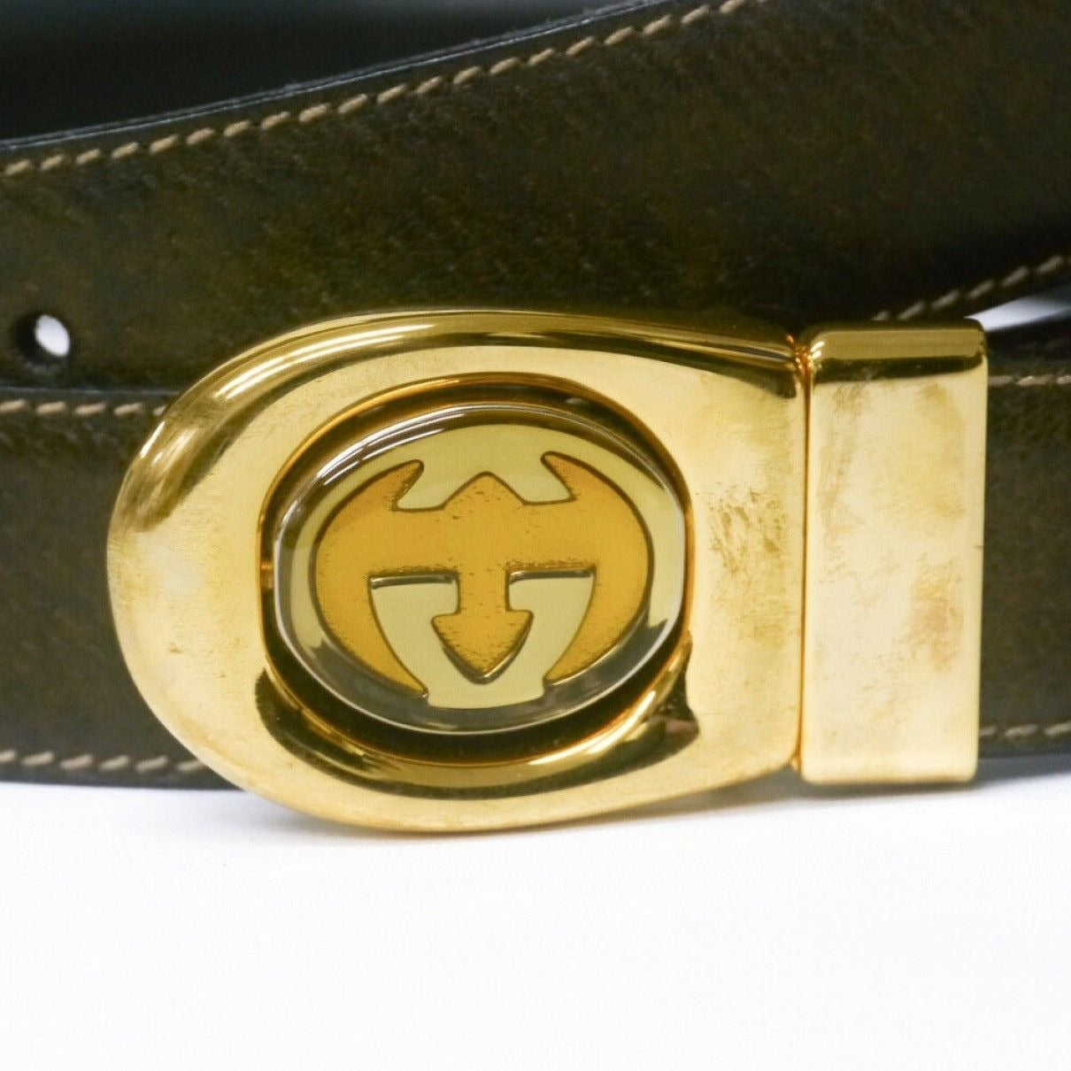 Vintage, Gucci, 44" long x 1.25" wide, brown or black leather, reversible belt in size 40" with a dual sided, two-tone engraved GG buckle