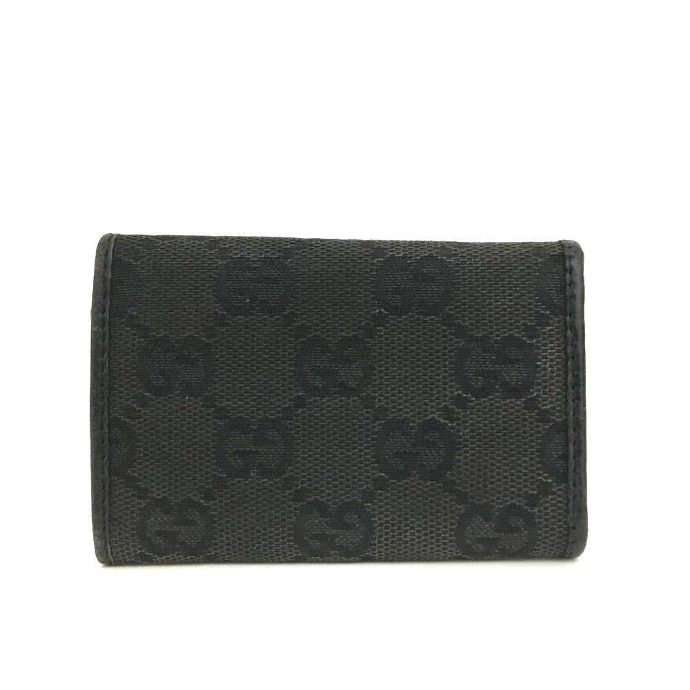 Gucci, black Guccissima print/leather, tri-fold, key holder/card holder, mini- wallet w bamboo accent & slots for your cards